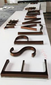 The Esplanade sign Group Global Brass & Stainless Steel Lettering