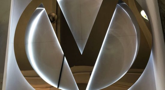 Sliver V Logo AVS Group Global Backlit Lettering