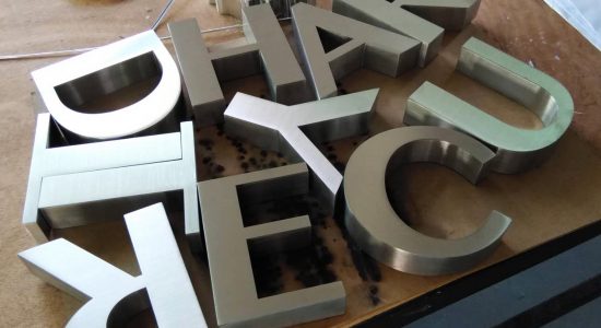 The Court Yard AVS Group Global Brass & Stainless Steel Lettering